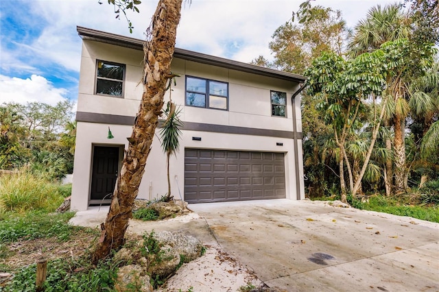 view of front of home with a garage