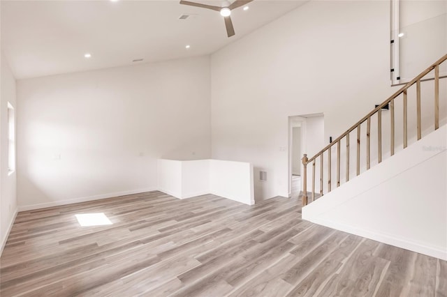 21048 Peachland Blvd, Port Charlotte, FL 33954 - spare room featuring wood finished floors, a ceiling fan, high vaulted ceiling, recessed lighting, and baseboards