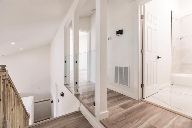 21048 Peachland Blvd, Port Charlotte, FL 33954 - corridor featuring wood finished floors, an upstairs landing, and recessed lighting