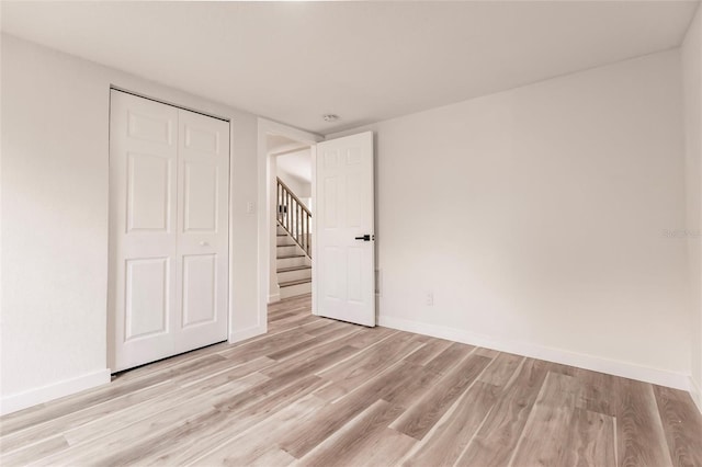 interior space with a closet and light wood-type flooring