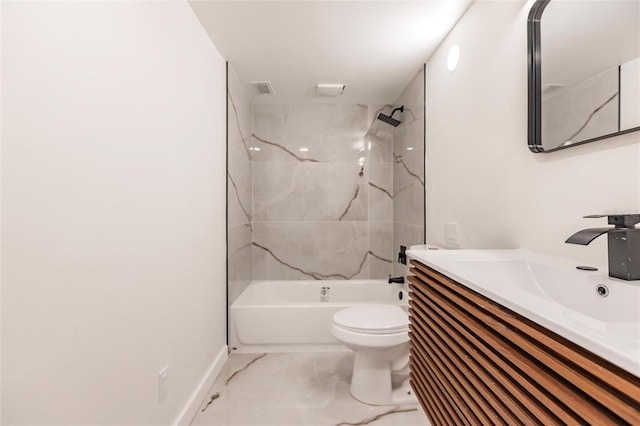 full bathroom featuring vanity, toilet, and tiled shower / bath combo