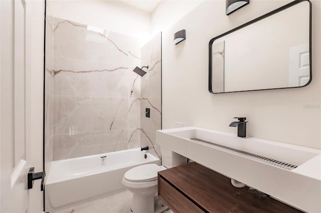 full bathroom with vanity, tiled shower / bath, and toilet