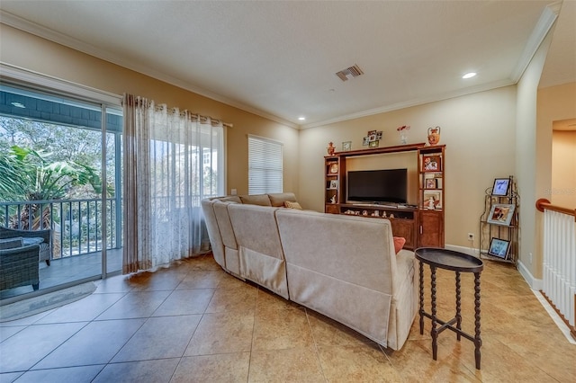 living room with light tile patterned floors and ornamental molding