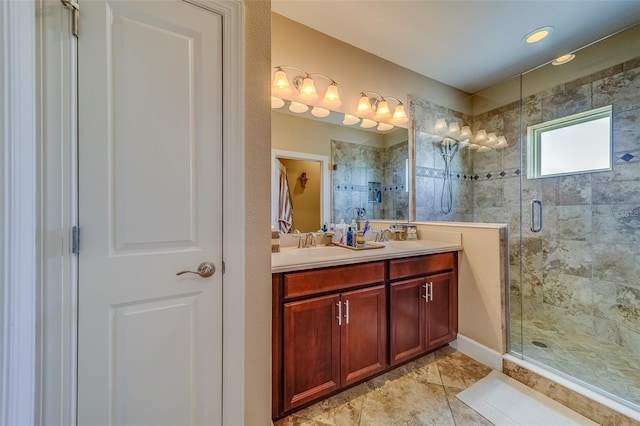 bathroom with a shower with door and vanity