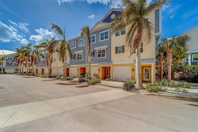 94 The Cove Way, Indian Rocks Beach, FL 33785 - townhome / multi-family property with a residential view and driveway