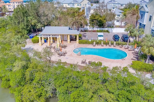 94 The Cove Way, Indian Rocks Beach, FL 33785 - community pool featuring a patio and a residential view