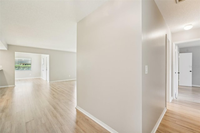 hall with light wood-type flooring