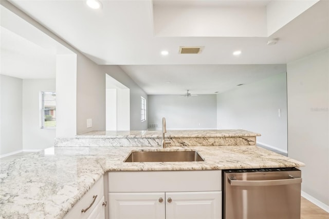 kitchen featuring light stone counters, sink, light hardwood / wood-style flooring, dishwasher, and white cabinetry