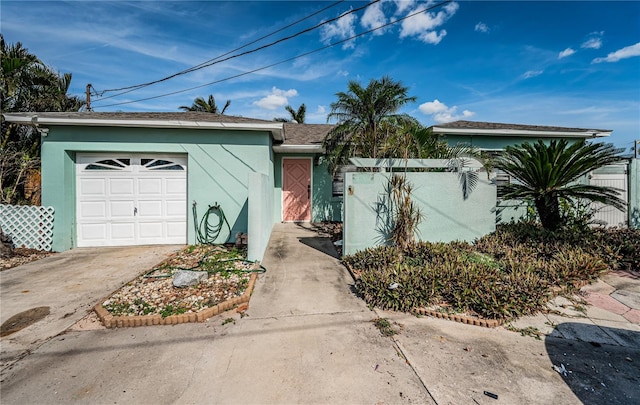 single story home with a garage