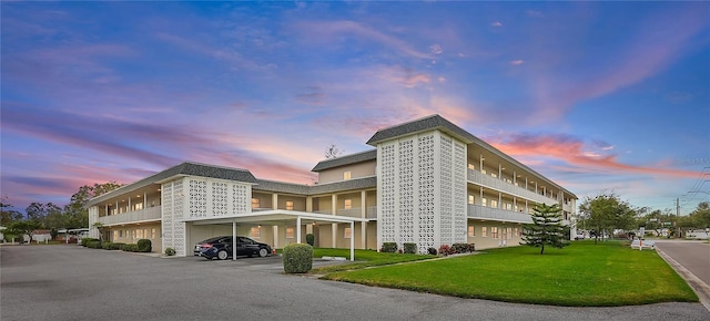 view of outdoor building at dusk