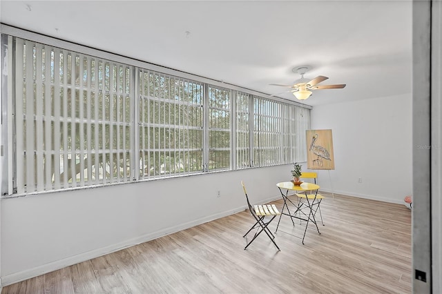 sunroom / solarium with ceiling fan