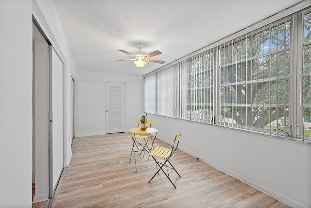 sunroom / solarium with ceiling fan and a healthy amount of sunlight