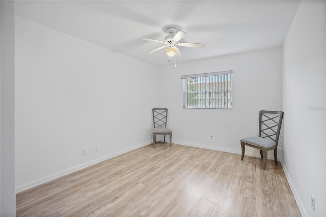 empty room with light wood-type flooring and ceiling fan