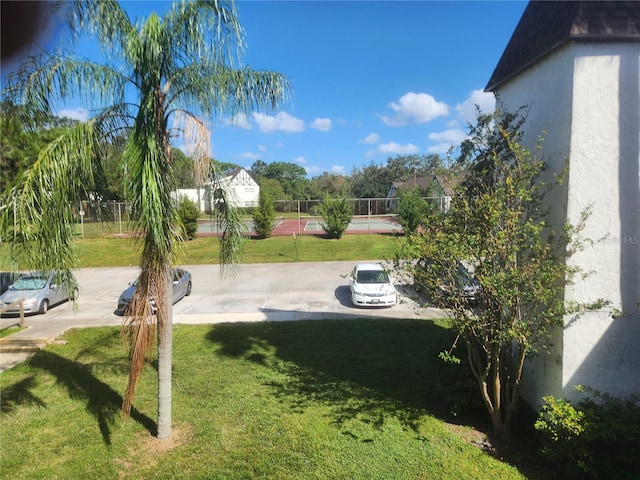 view of yard featuring tennis court