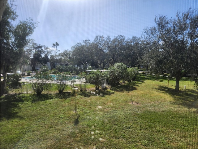 view of yard with a community pool