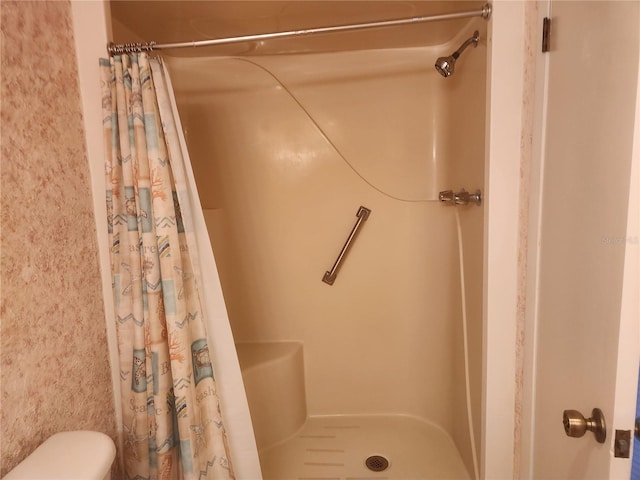 bathroom with a shower with shower curtain