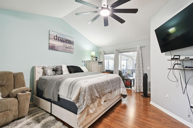 bedroom with hardwood / wood-style flooring, ceiling fan, and lofted ceiling