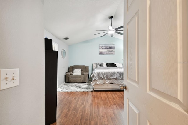 bedroom featuring wood-type flooring, ceiling fan, and lofted ceiling