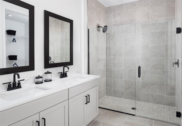 bathroom featuring vanity, an enclosed shower, and tile patterned flooring