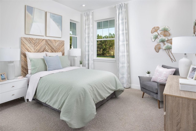 bedroom featuring light colored carpet