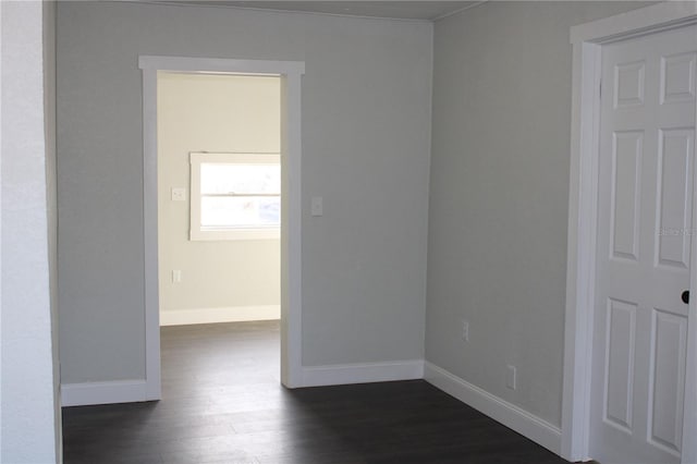 empty room with dark hardwood / wood-style floors