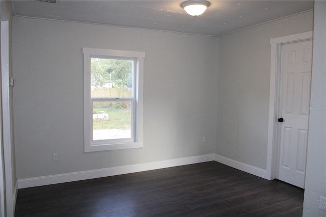 spare room featuring dark hardwood / wood-style flooring