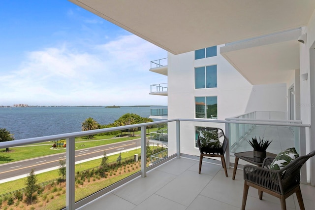 balcony featuring a water view