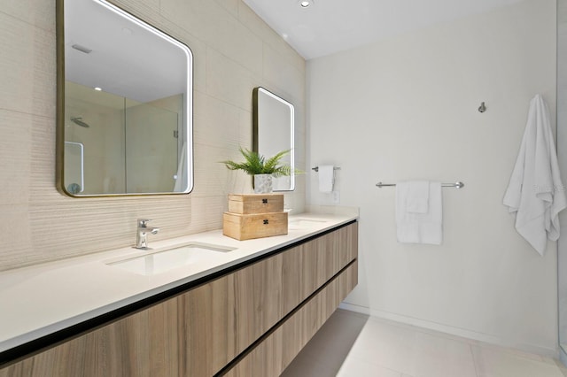 bathroom featuring tile patterned flooring, vanity, and walk in shower