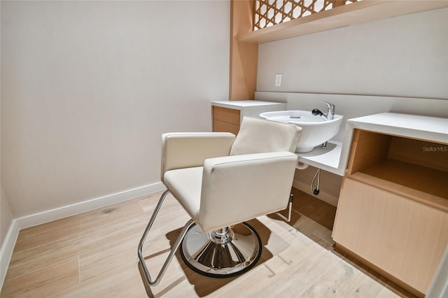 interior space with light hardwood / wood-style flooring and sink