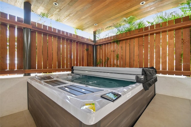 exterior space with a hot tub