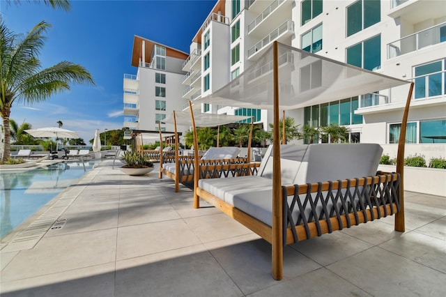 view of home's community with a patio area and a pool