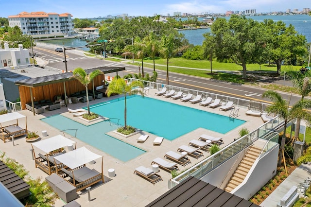 view of pool with a water view