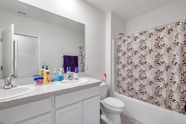 full bathroom featuring tile patterned floors, vanity, shower / tub combo, and toilet