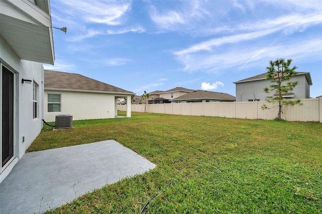 view of yard featuring a patio and central AC