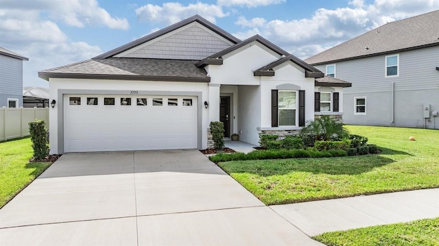 view of front of home featuring a front yard and a garage