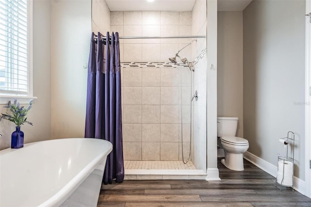 bathroom featuring hardwood / wood-style flooring, toilet, and independent shower and bath