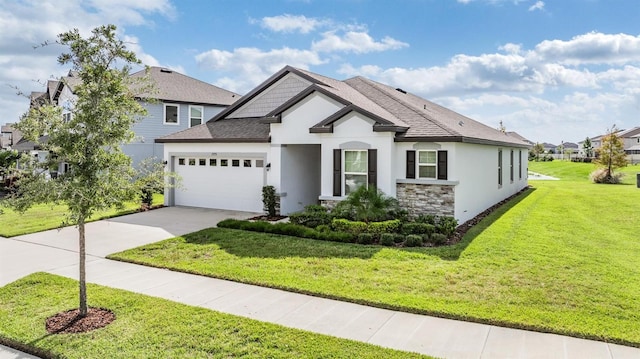 view of front of property featuring a garage and a front lawn