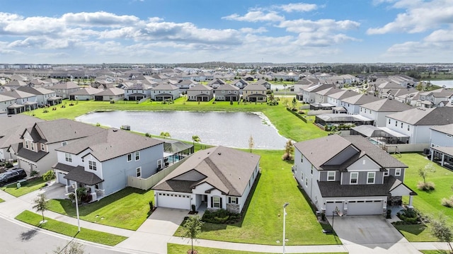 birds eye view of property with a water view