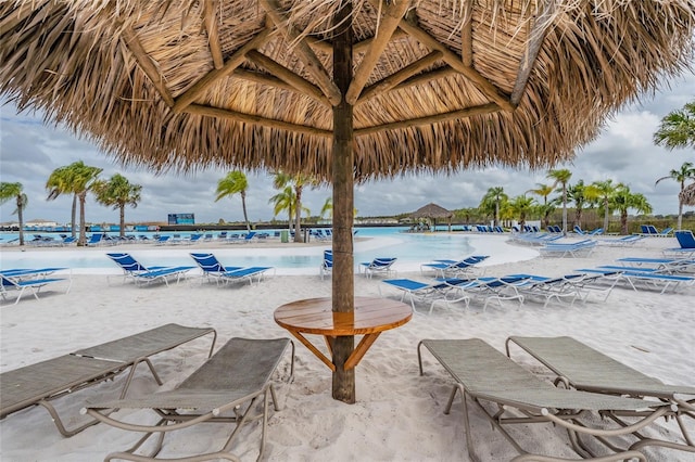 view of pool featuring a gazebo and a water view