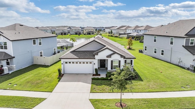 view of front of home with a garage and a front yard