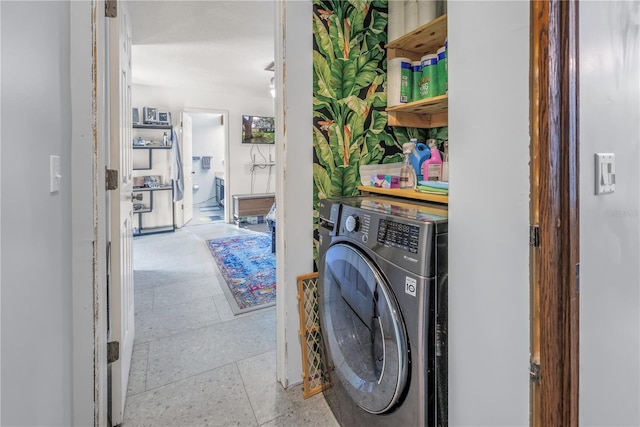 clothes washing area with washer / clothes dryer