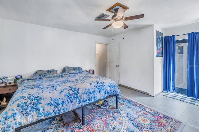 bedroom with a textured ceiling and ceiling fan