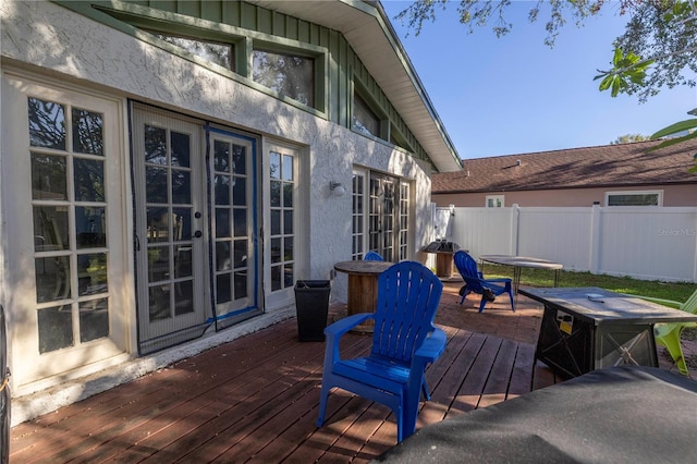 wooden terrace featuring french doors