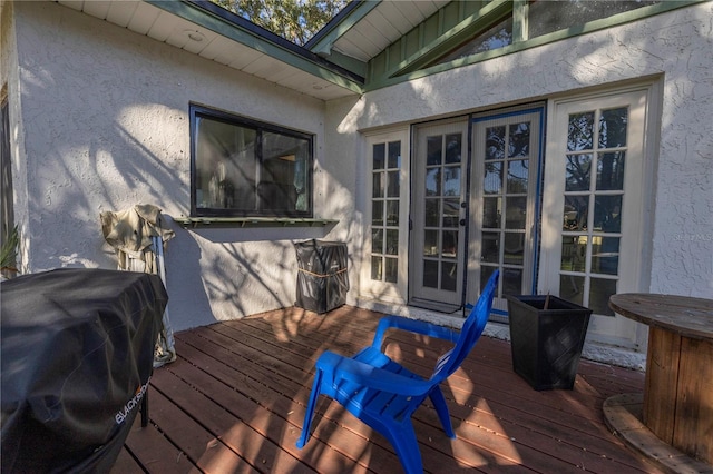 wooden terrace featuring grilling area