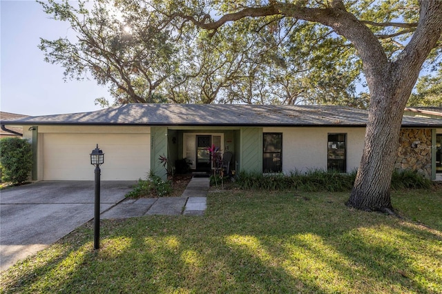 single story home with a garage and a front yard