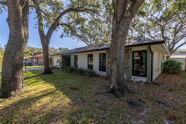 rear view of house with a yard