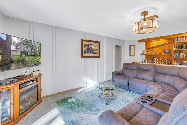 living room featuring a notable chandelier