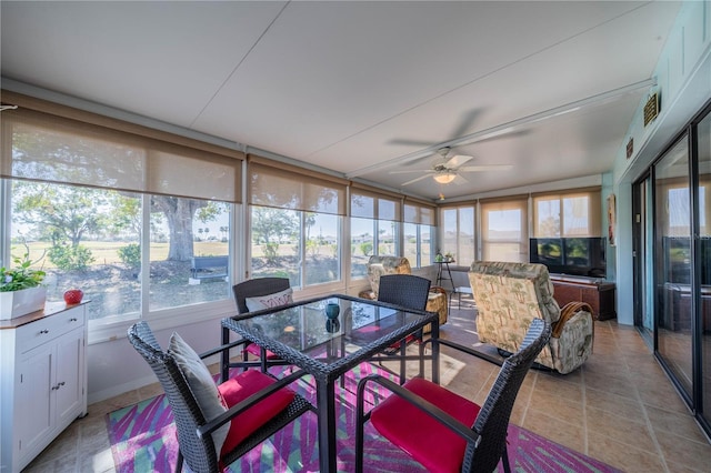 sunroom / solarium with ceiling fan and a healthy amount of sunlight