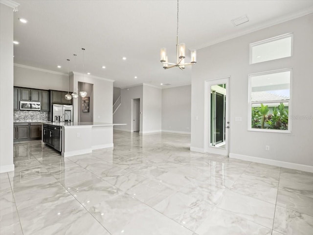 interior space with crown molding and a chandelier