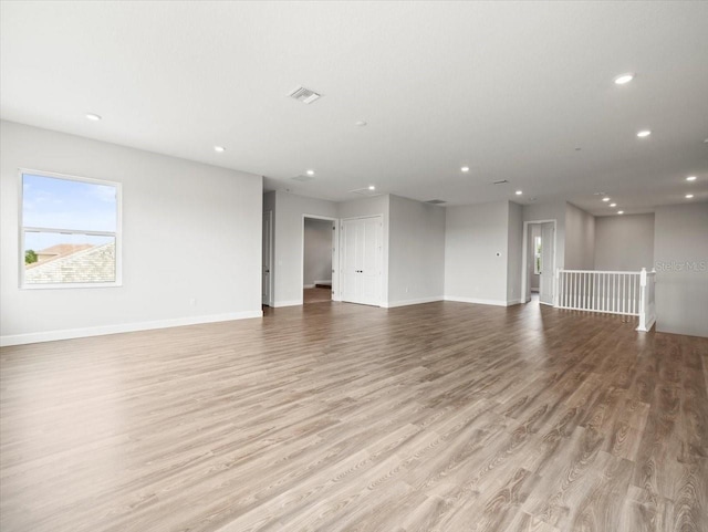 unfurnished living room with light wood-type flooring